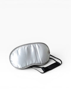 JONES + CO Morihata Binchotan Charcoal Eye Mask in silver satin with grey trim and black adjustable strap.