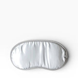 JONES + CO Morihata Binchotan Charcoal Eye Mask in silver satin with grey trim, ideal for relaxation and sleep.