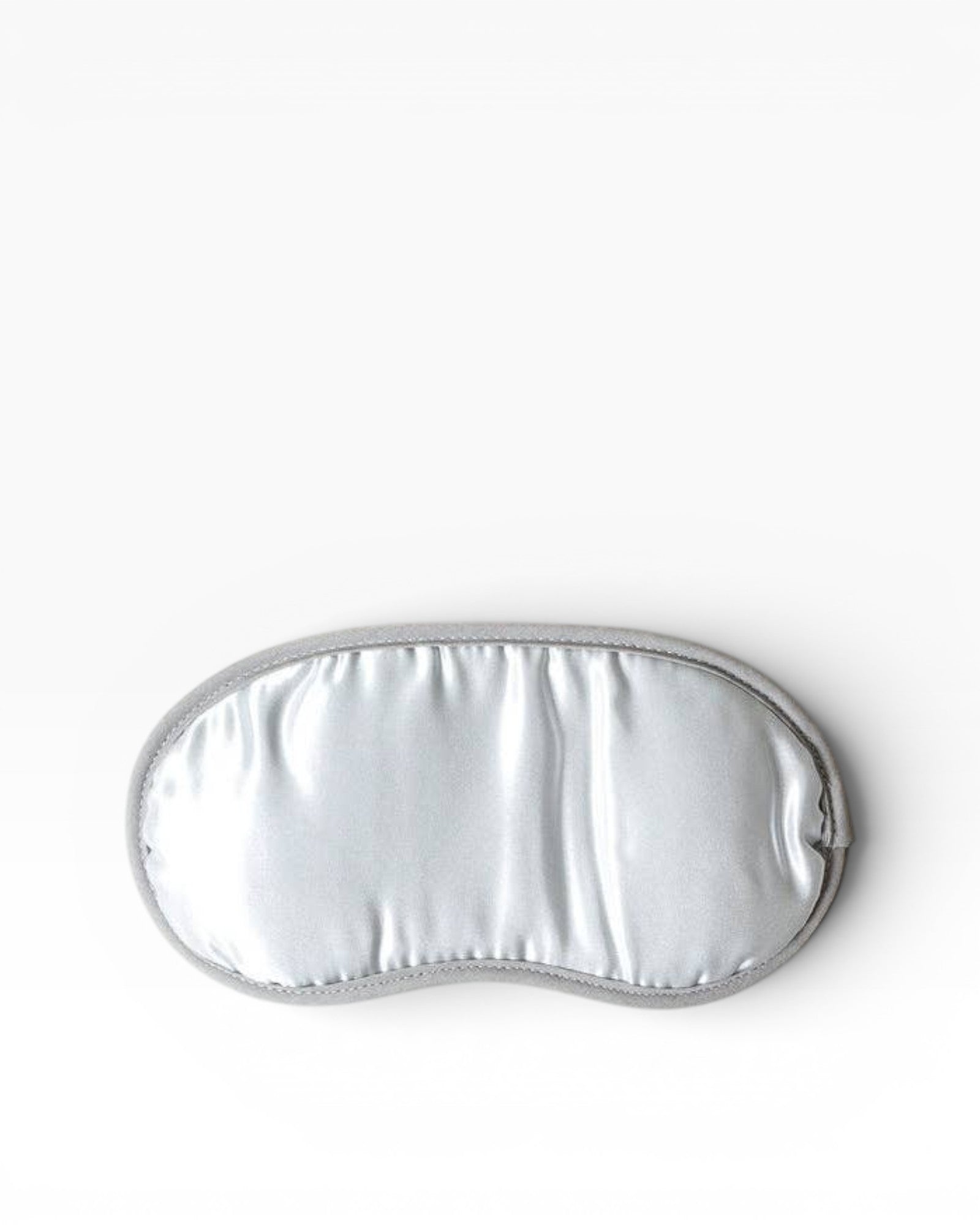 JONES + CO Morihata Binchotan Charcoal Eye Mask in silver satin with grey trim, ideal for relaxation and sleep.