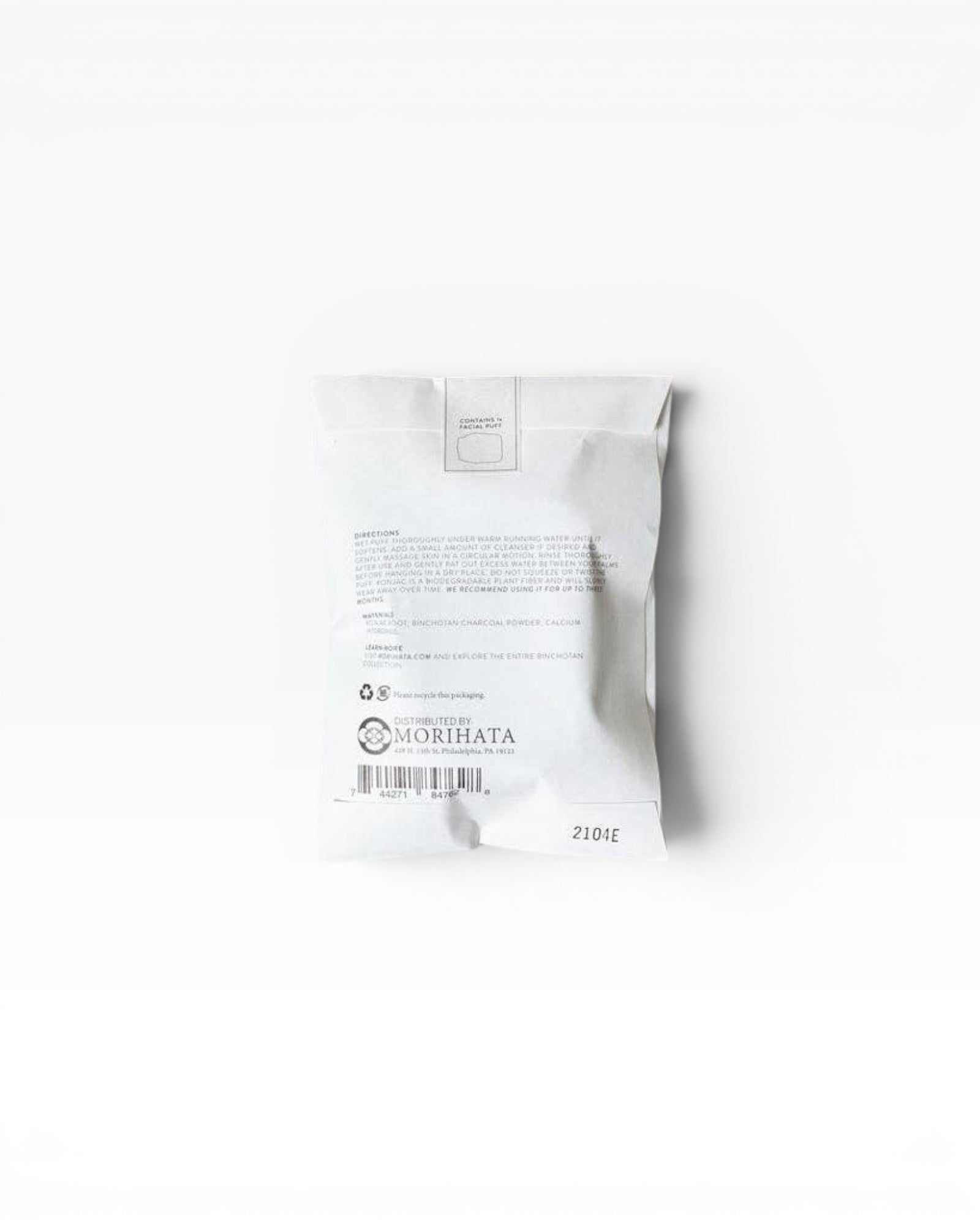 JONES + CO Binchotan Charcoal Facial Puff, made from konjac root and charcoal powder for gentle exfoliation and cleansing.