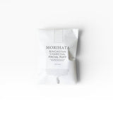 JONES + CO Binchotan Charcoal Facial Puff, made from konjac root and charcoal powder for gentle exfoliation and brighter skin.