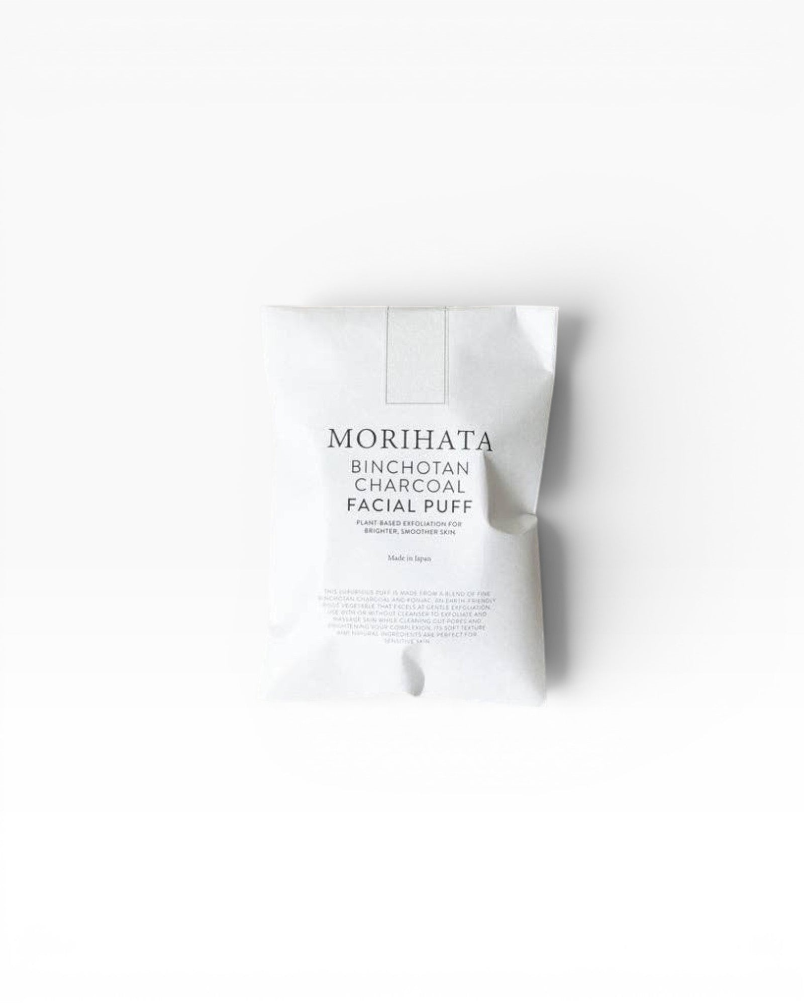 JONES + CO Binchotan Charcoal Facial Puff, made from konjac root and charcoal powder for gentle exfoliation and brighter skin.