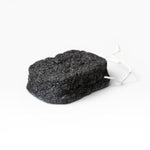 JONES + CO Binchotan charcoal facial puff made from konjac root and charcoal powder for gentle exfoliation and cleansing.