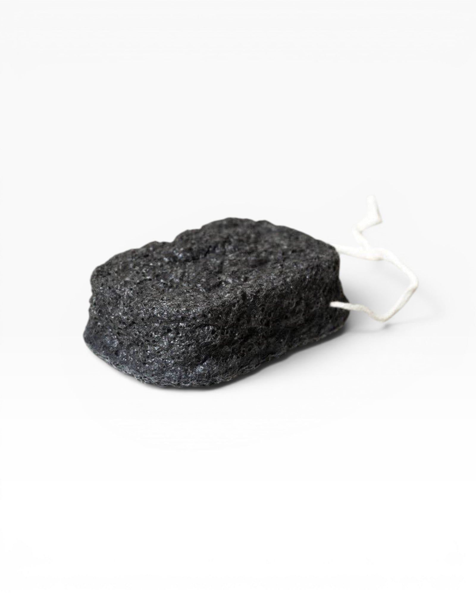 JONES + CO Binchotan charcoal facial puff made from konjac root and charcoal powder for gentle exfoliation and cleansing.