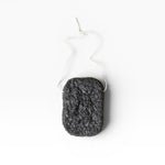 JONES + CO Binchotan charcoal facial puff made from konjac root and charcoal powder for gentle exfoliation and cleansing.