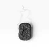 JONES + CO Binchotan charcoal facial puff made from konjac root and charcoal powder for gentle exfoliation and cleansing.