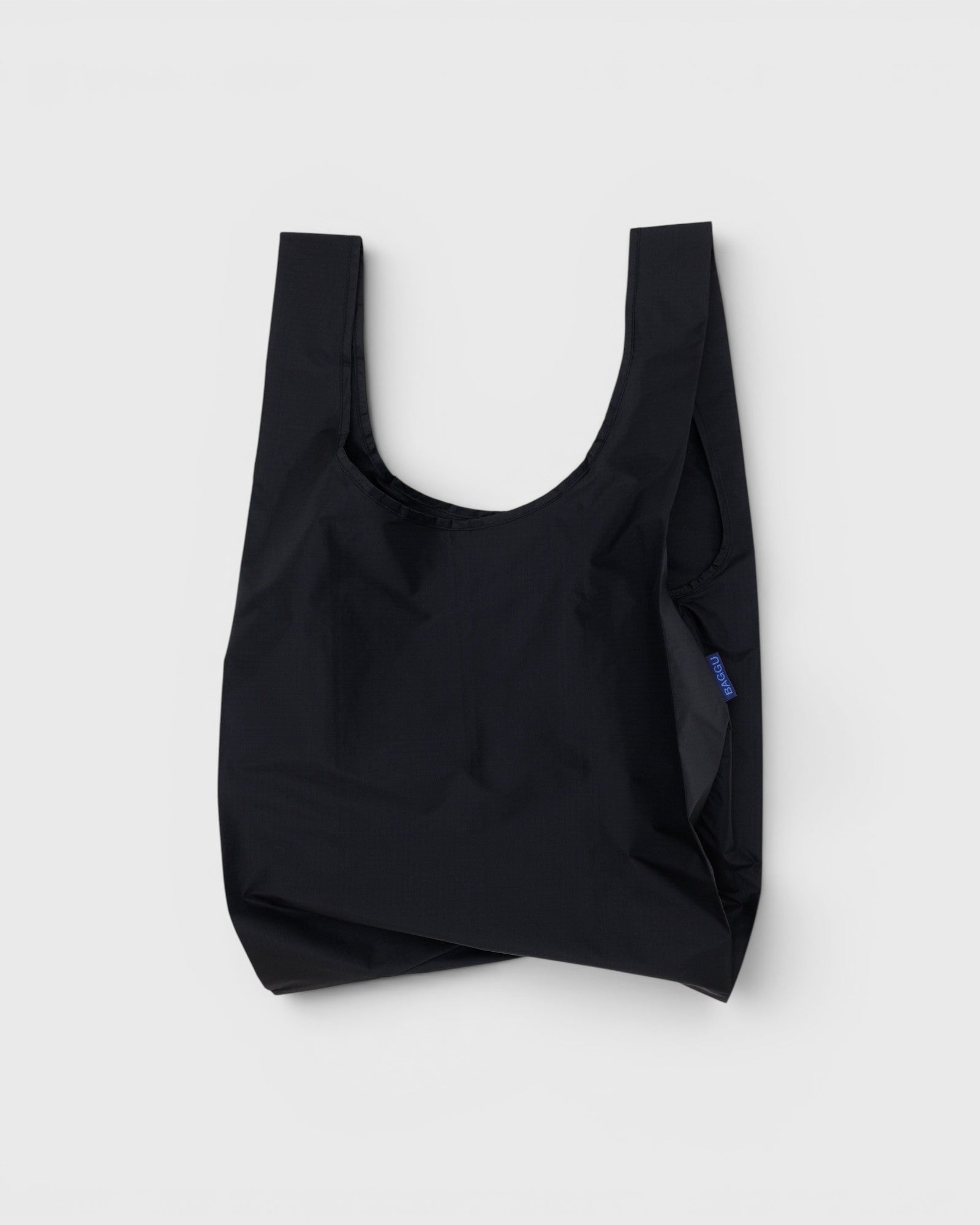 JONES + CO black Baggu reusable tote bag made from lightweight ripstop nylon for everyday use.