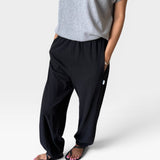 JONES + CO black heavy cotton balloon pants with elastic leg openings and side pockets.