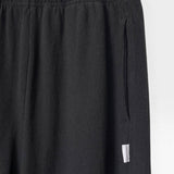 JONES + CO black heavy cotton balloon pants with elastic waistband and side pockets.