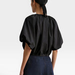 JONES + CO black cropped V-neck balloon top in organic cotton poplin with drawstring waist, back view
