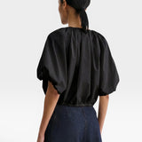 JONES + CO black cropped V-neck balloon top in organic cotton poplin with drawstring waist, back view