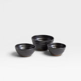 JONES + CO handcrafted black ceramic little bowls with a ribbed texture for kitchen storage or home decor.