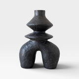 JONES + CO black ceramic vessel with a unique sculptural form and textured finish.