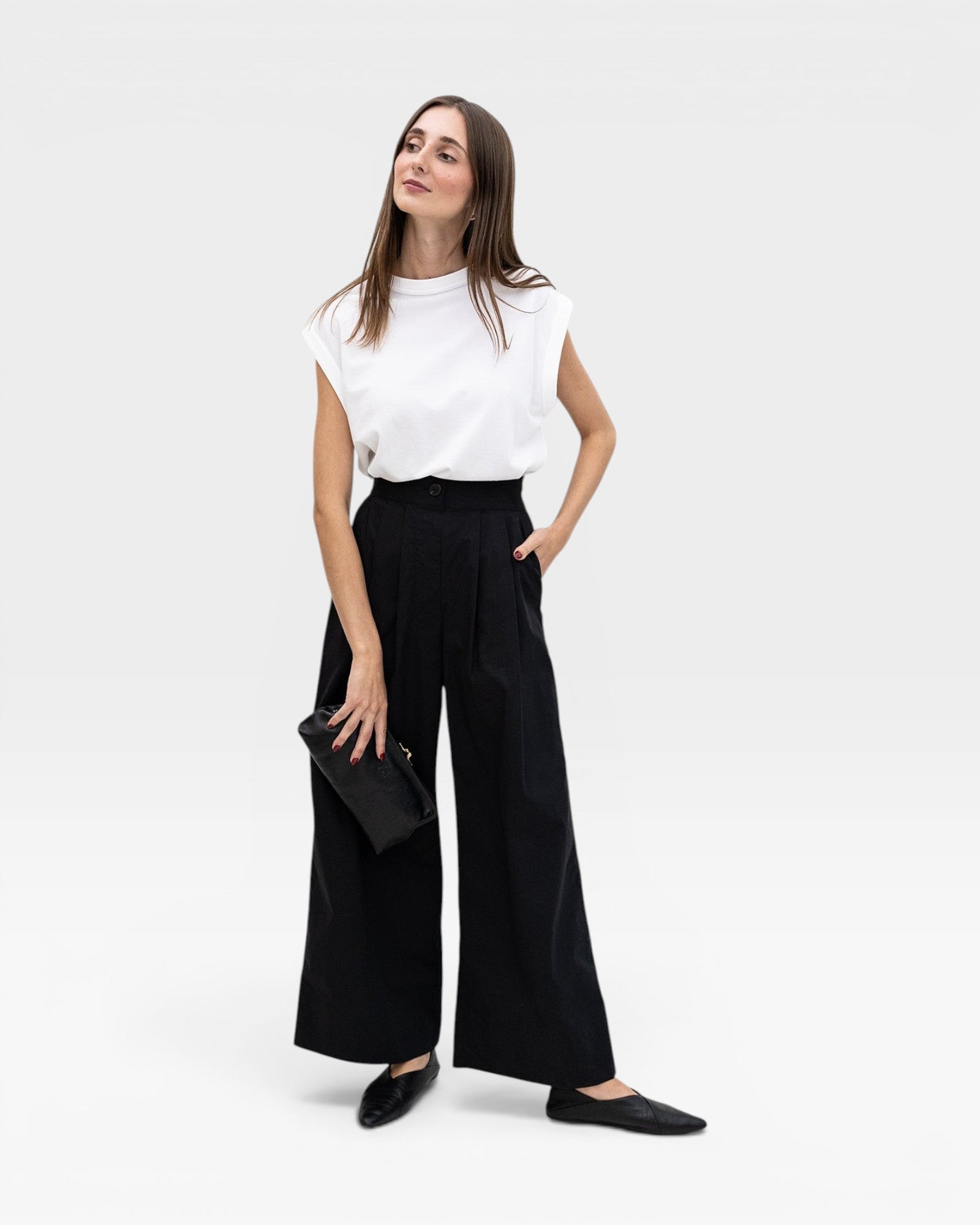 JONES + CO black high-waisted wide-leg cotton trousers with pleats, paired with a white top.