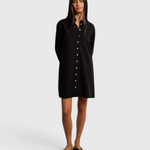 Model wearing a JONES + CO black cotton poplin shirt dress with a button-front design against a neutral backdrop.