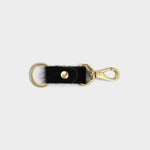 JONES + CO black cowhide keychain with gold-tone metal hardware and a secure lobster clasp