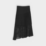 JONES + CO black crochet asymmetrical midi skirt with mesh hem detail.