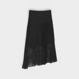 JONES + CO black crochet asymmetrical midi skirt with mesh hem detail.