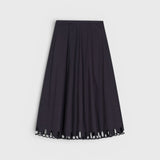 JONES + CO black midi skirt with a flared silhouette and intricate cut-out embroidery along the hem.