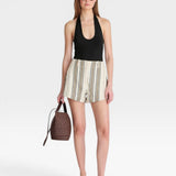 JONES + CO black halter neck bodysuit with a deep scoop neckline, paired with striped shorts.