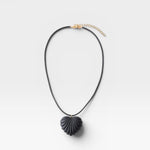 JONES + CO black acrylic shell-inspired heart pendant necklace on leather cording.