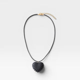 JONES + CO black acrylic shell-inspired heart pendant necklace on leather cording.