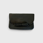 JONES + CO black leather petite card case featuring a charming knotted bow detail and slim magnetic flap closure.
