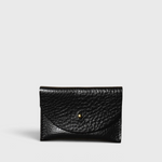 JONES + CO black pebbled leather cardholder with a minimalist envelope flap and gold stud closure.