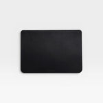 JONES + CO black leather Lia laptop sleeve with handwoven carré detail on one side.