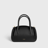 JONES + CO Oyster Mini Duffle in black pebble grained Italian leather with gold-tone hardware and top handles.