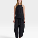 JONES + CO black Lyocell blend balloon-leg trousers with elasticated waistband and ankle buttons.