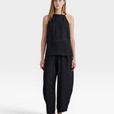 JONES + CO black Lyocell blend balloon-leg trousers with elasticated waistband and ankle buttons.