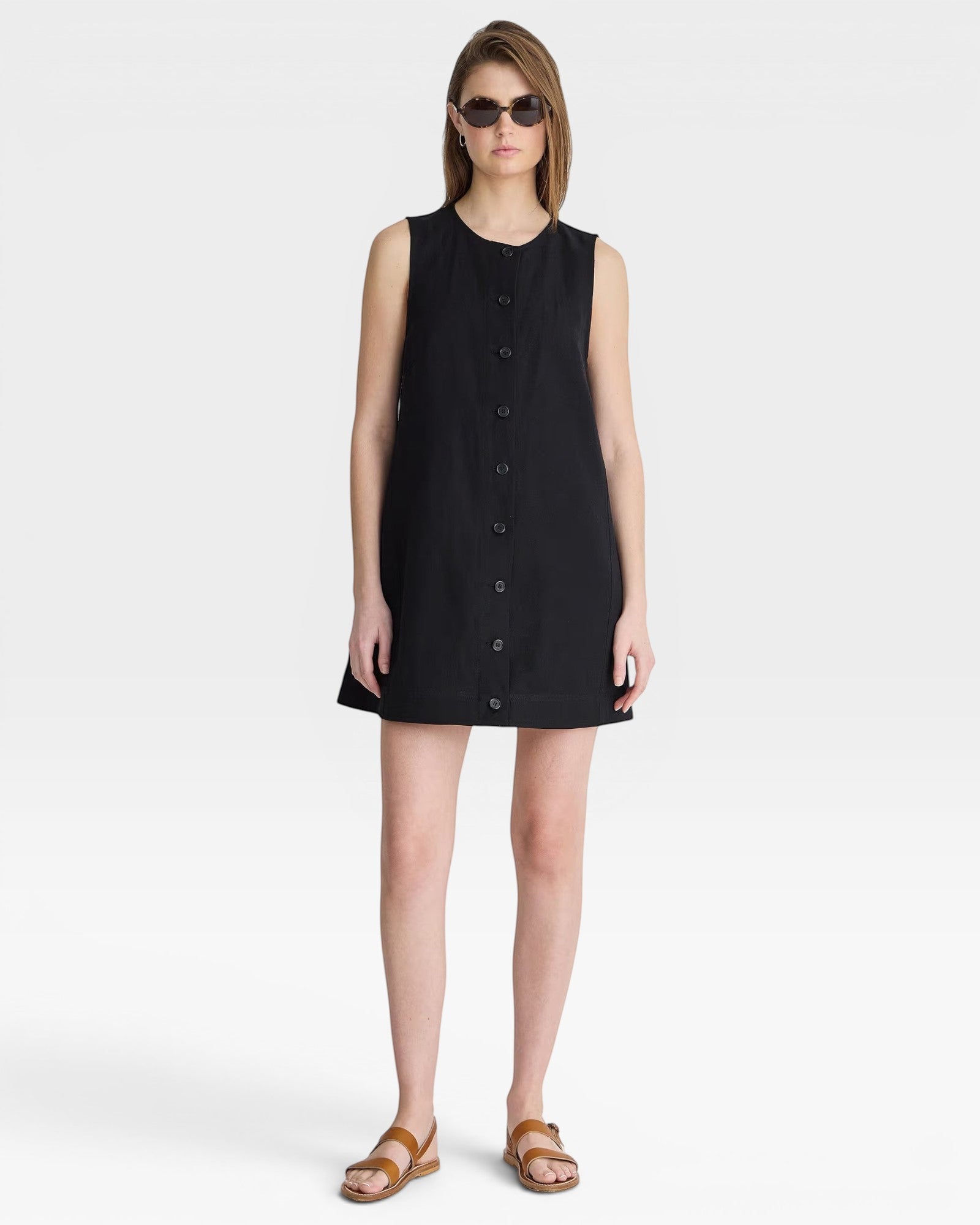 JONES + CO black sleeveless mini shift dress with button front and round neckline, perfect for casual wear.