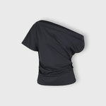 JONES + CO black one-shoulder Mata top in organic crisp cotton with an asymmetric neckline and fluid drape.