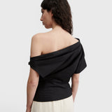 JONES + CO black one-shoulder Mata top in organic crisp cotton with an asymmetric neckline and short sleeve.