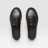 JONES + CO Sydney black crinkle patent leather penny loafers with ruched detailing, top-down view.