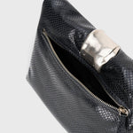JONES + CO black snake-embossed leather slouchy clutch with a polished silver organic metal cuff detail