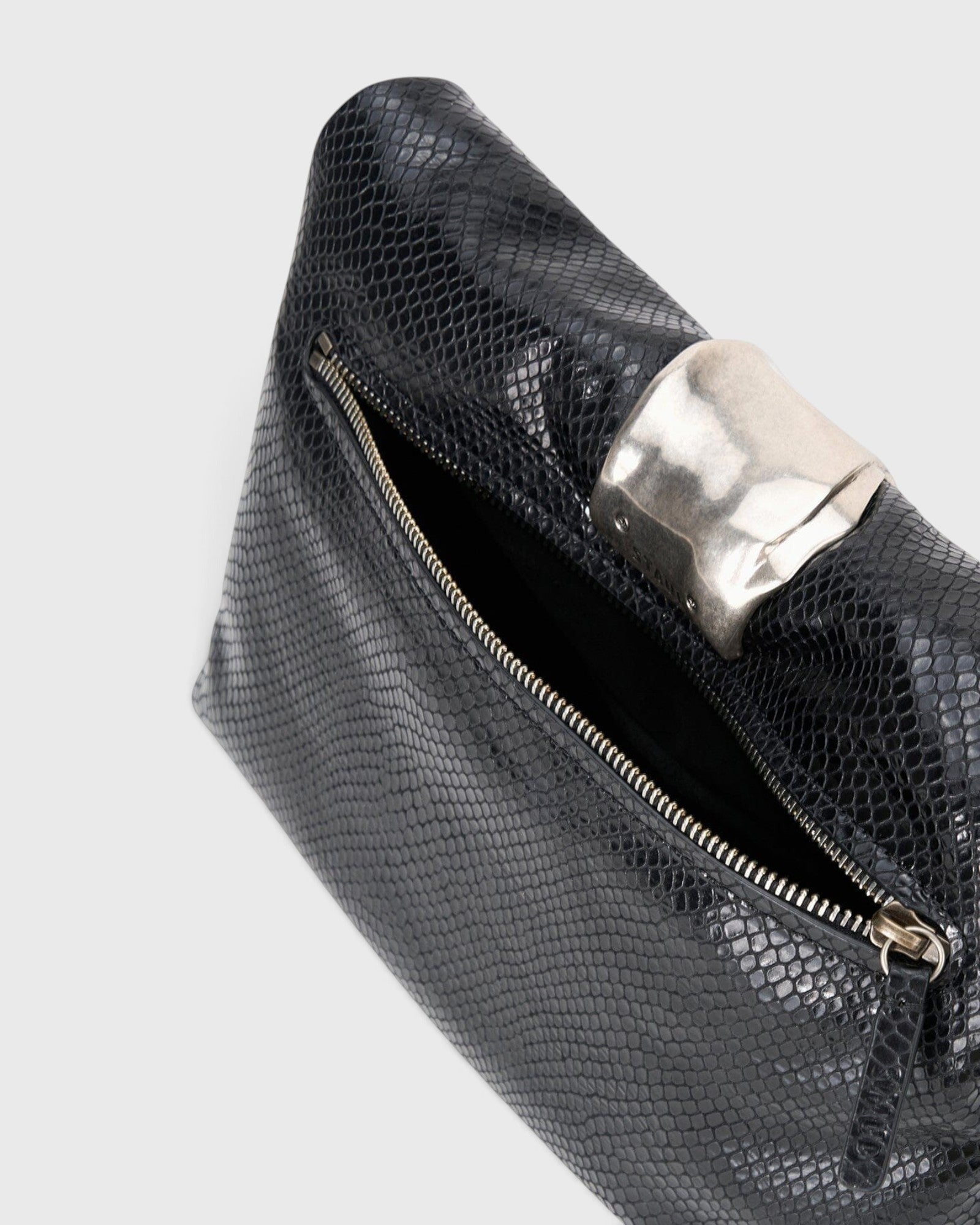JONES + CO black snake-embossed leather slouchy clutch with a polished silver organic metal cuff detail