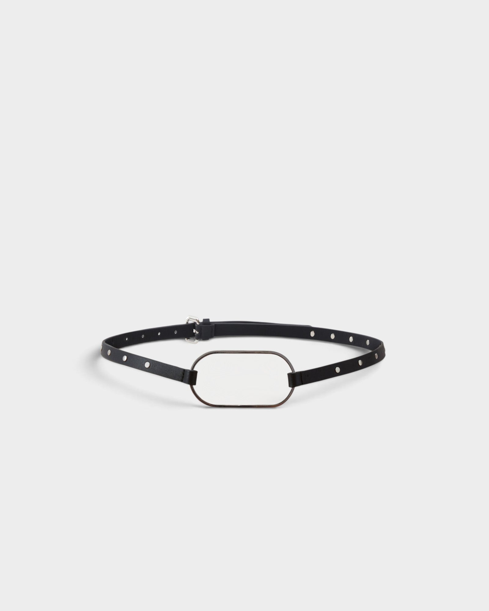 JONES + CO black crust leather belt with an oversized oval buckle and polished metal rivets along the slim strap.