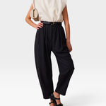 JONES + CO black wool Brady trousers featuring a high-waisted, gathered design with a tapered, cropped leg fit.