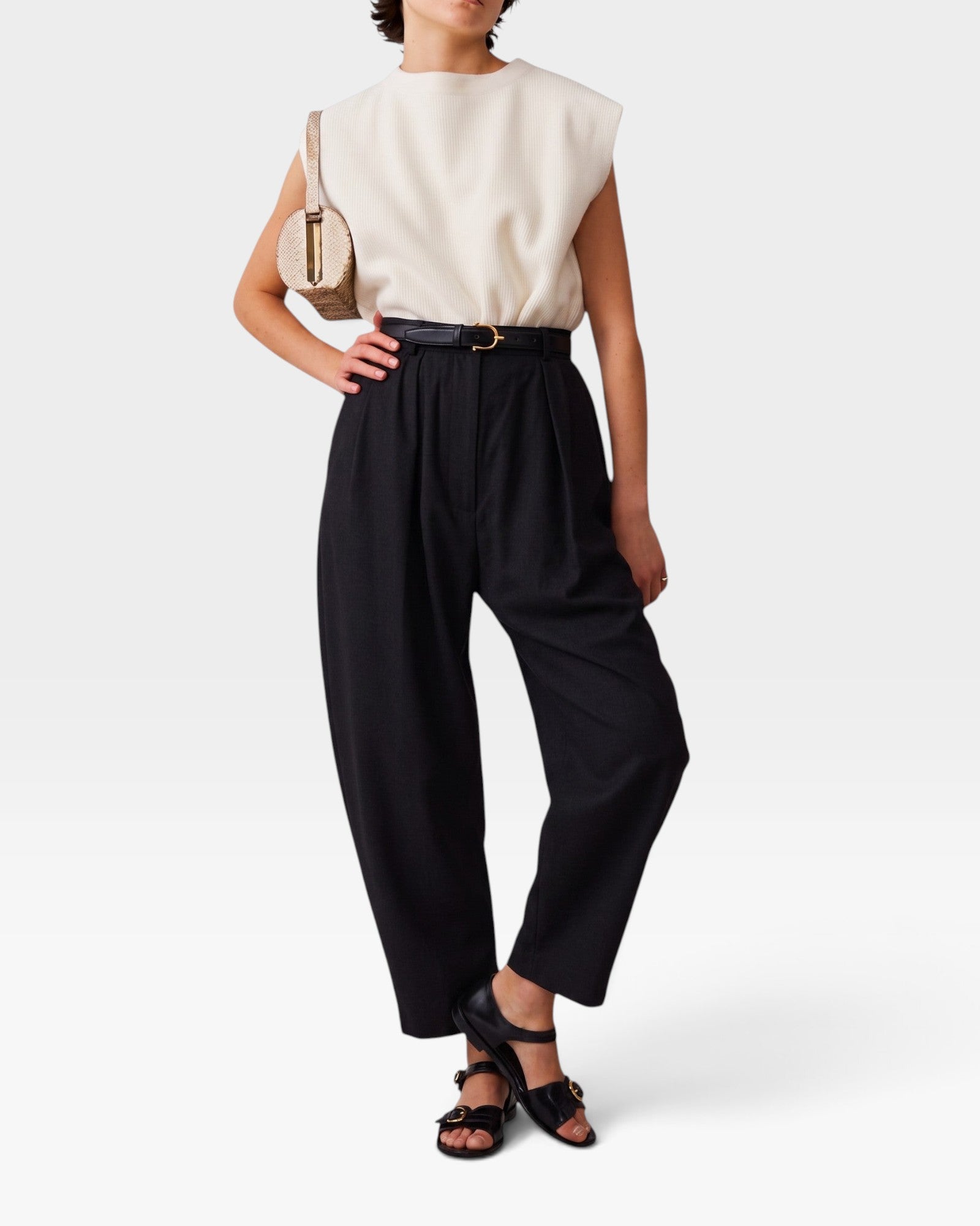 JONES + CO black wool Brady trousers featuring a high-waisted, gathered design with a tapered, cropped leg fit.