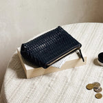 JONES + CO black woven leather Cleo Pouch with zip closure, perfect for organizing essentials.
