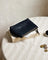 JONES + CO black woven leather Cleo Pouch with zip closure, perfect for organizing essentials.