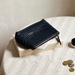 JONES + CO black woven leather Cleo Pouch with zip closure, perfect for organizing essentials.