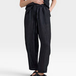 JONES + CO black Lyocell blend balloon-leg trousers with elasticated waistband and adjustable drawstrings.