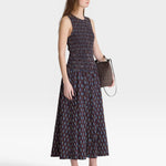 JONES + CO women's sleeveless maxi dress with block print polka dot pattern and smocked bodice in navy, red, and blue.