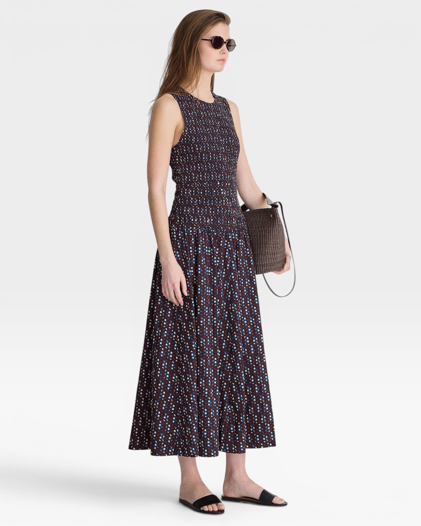 JONES + CO women's sleeveless maxi dress with block print polka dot pattern and smocked bodice in navy, red, and blue.