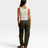 JONES + CO Blondie bright ivory ribbed tank top worn with olive green trousers, back view