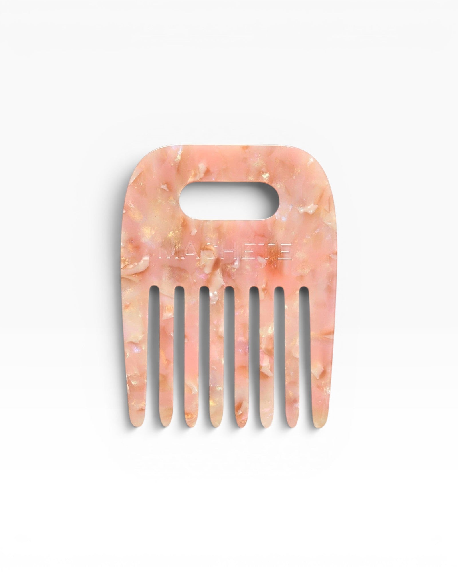 JONES + CO No. 4 Comb in Blossom, a wide-tooth comb handmade from Italian acetate in a marbled pink and gold pattern.