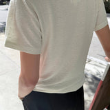 JONES + CO Bo Linen Blend Tee in Salt. Relaxed fit, crew neck, short sleeves, textured, sheer fabric.